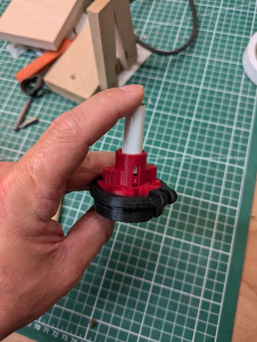 The new adapter design with the spring locked into the adapter